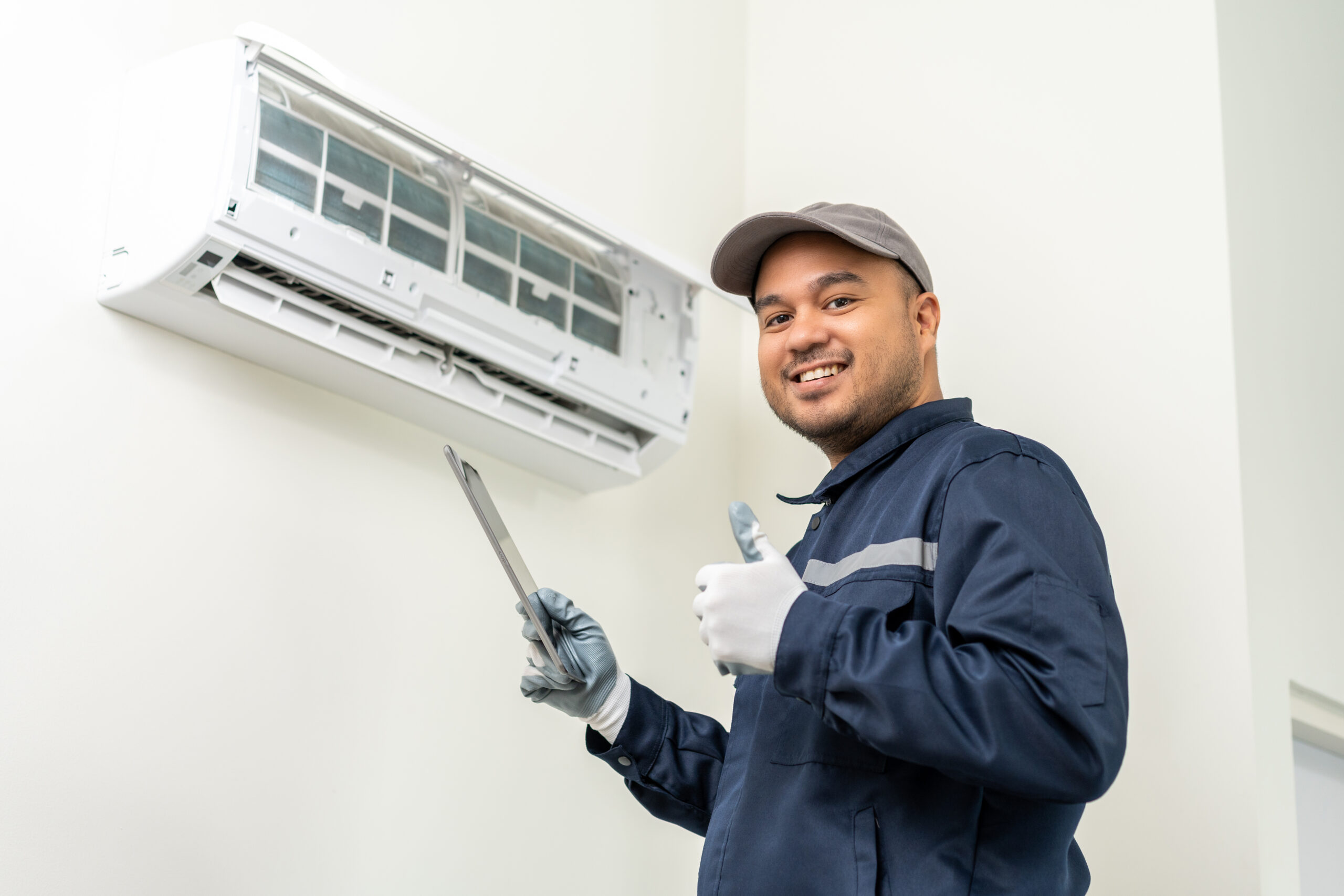 A facility services expert making repairs in a multifamily unit.