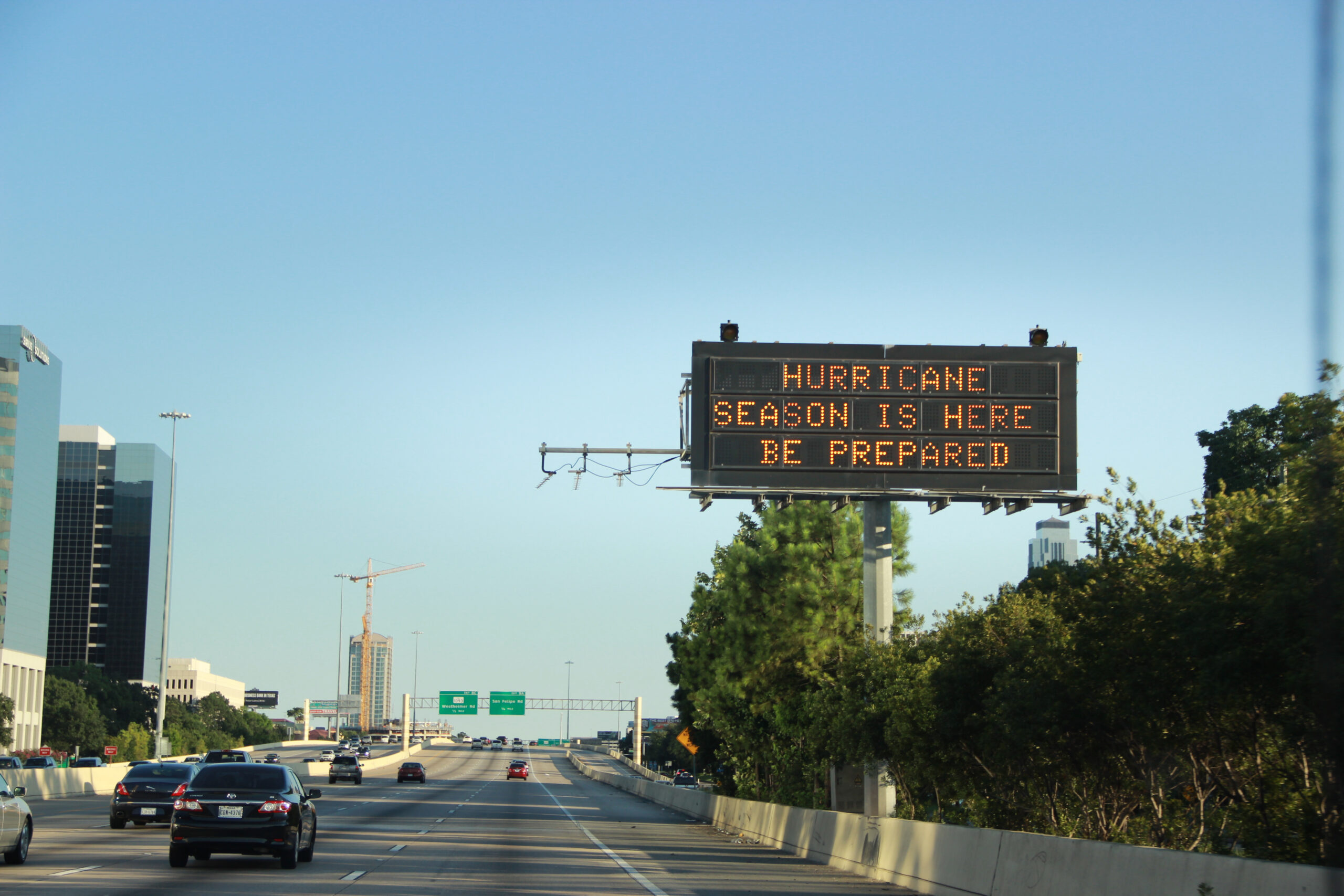 A digital highway sign displaying a warning message about the hurricane season ahead.