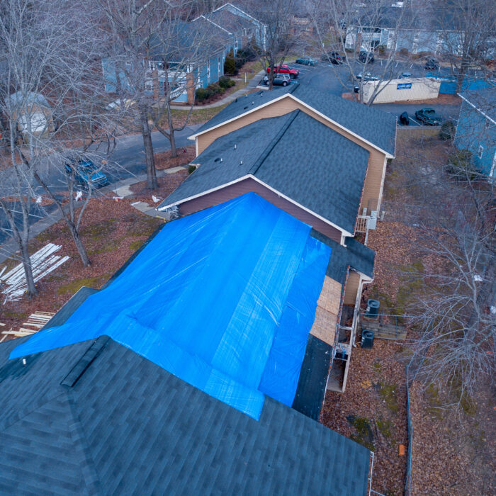 An overhead shot of an apartment building undergoing restoration services.